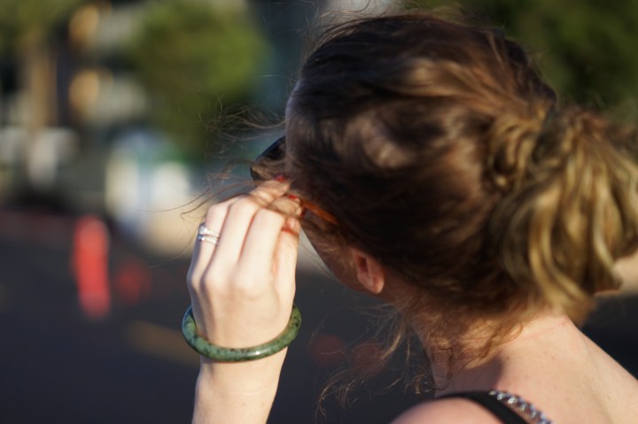 Woman adjusting Sunglasses www. InstantFashionMix.com